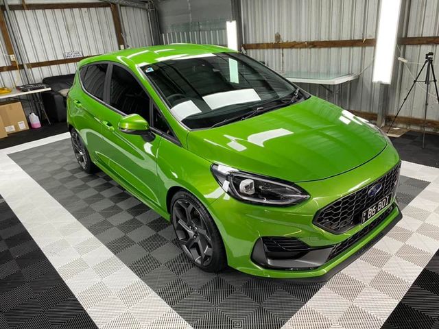 A green ford fiesta st is parked in a garage - window tinting by Tint Wright Brisbane