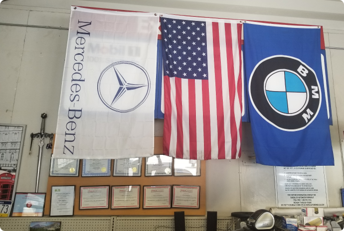 Different flags inside of our auto repair shop | T & T Auto Repair