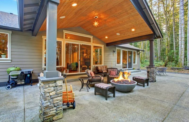 There is a Fire Pit on the Patio of a House  — Turnscape Landscaping in Hope Island, QLD