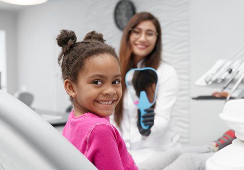 Girl Sitting on Dentist Chair — Plano, TX — UBP Insurance