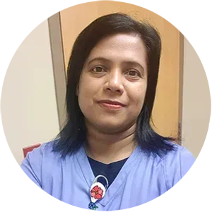 A woman in a blue scrub top is smiling in a circle.