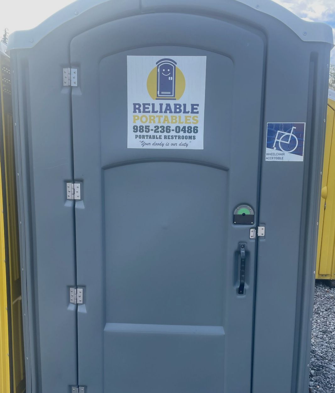 A portable toilet with a sticker that says reliable portables