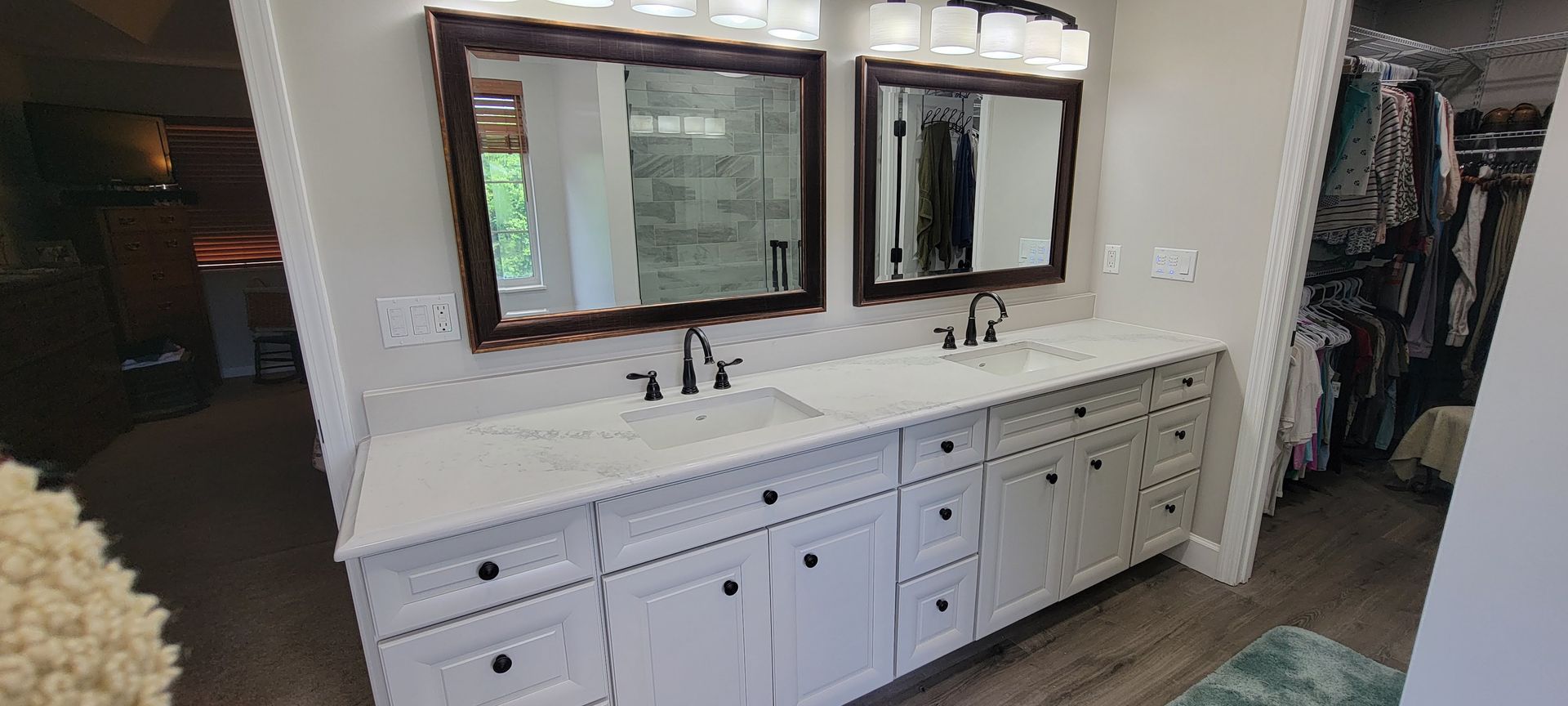A bathroom with two sinks and two mirrors.