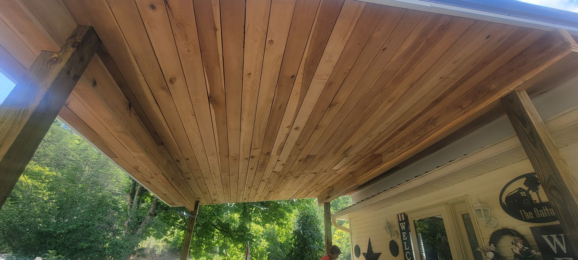 The ceiling of a wooden structure is being built.