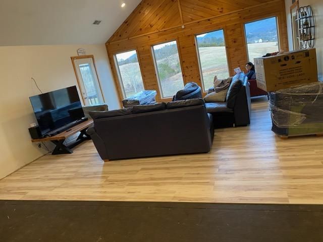 A living room filled with furniture and a flat screen tv.