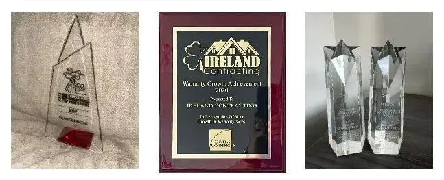 Awards: clear acrylic, framed plaque, and two star-topped glass sculptures.