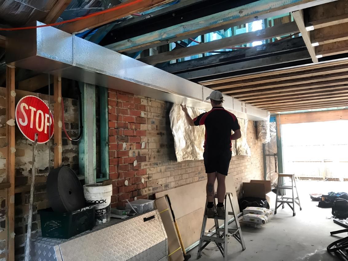 Man Maintaining Air-condition — Coolman Airconditioning in Lismore, NSW