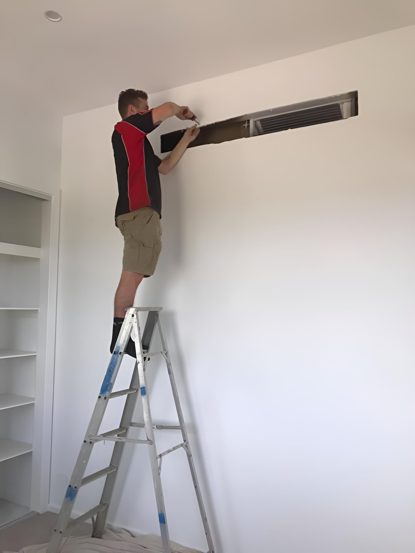 Man Repairing Ducted Aircondition — Coolman Airconditioning in Evans Head, NSW