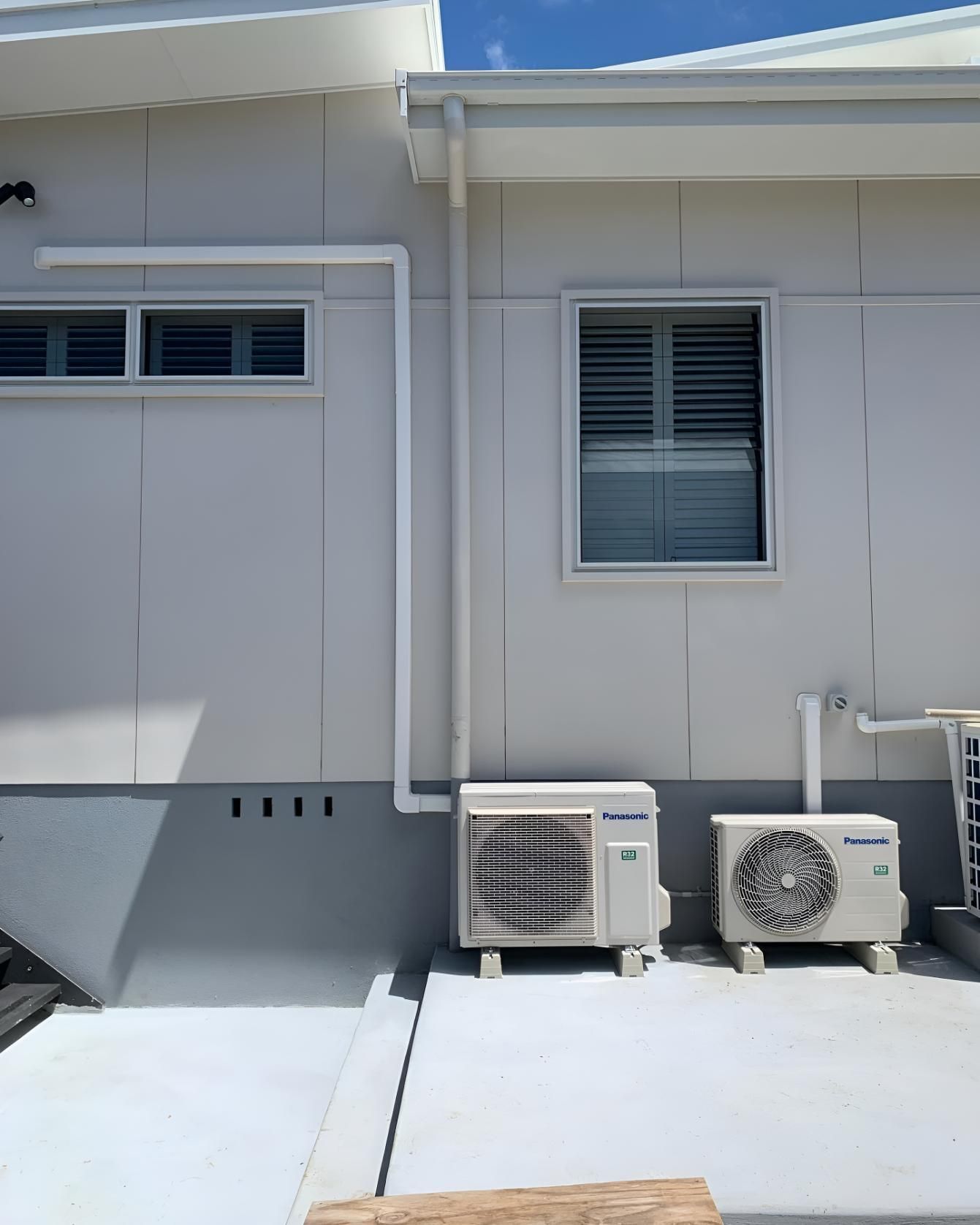 White House With Two Air Conditioners — Coolman Airconditioning in Broken Head, NSW
