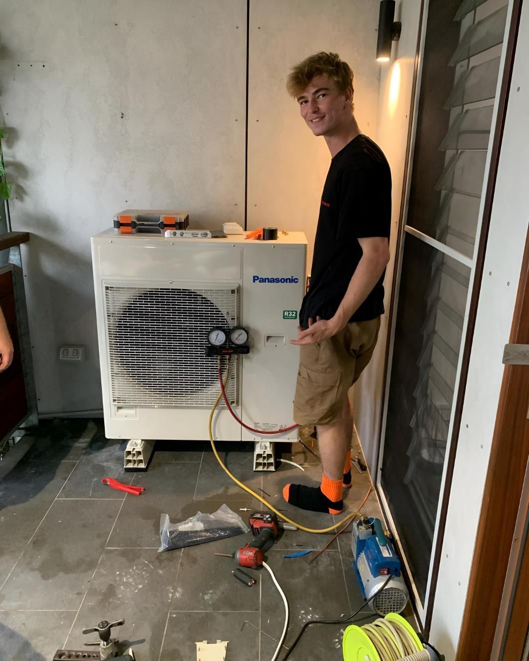 Man Doing Installation of Panasonic Aircon — Coolman Airconditioning in Broken Head, NSW