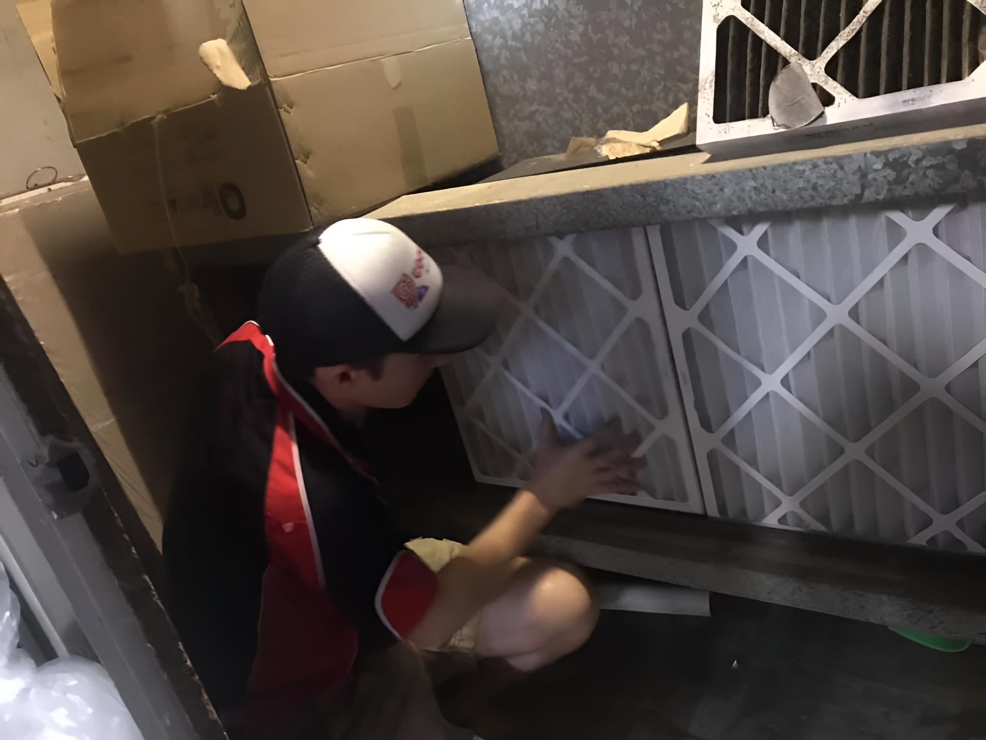 Man Working on Filter of Aircondition — Coolman Airconditioning in Wollongbar, NSW