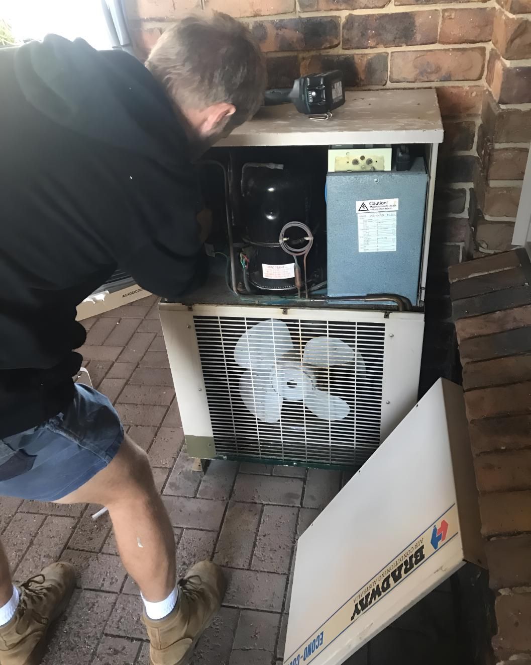 Man is Working on an Air Conditioner — Coolman Airconditioning in Alstonville, NSW