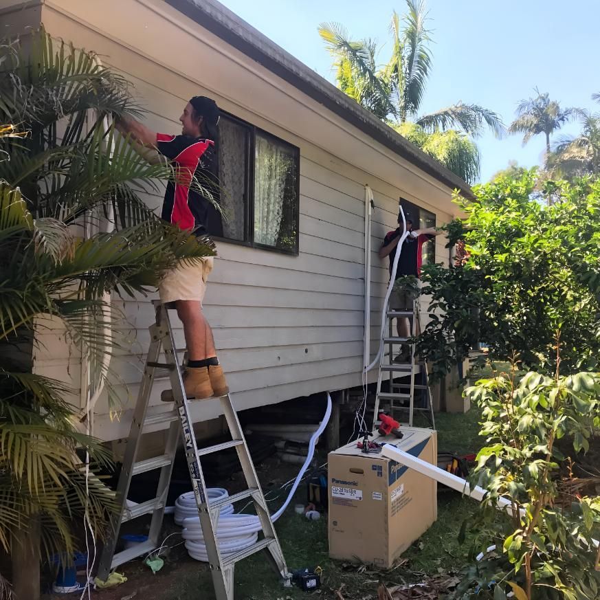 Man Maintaining Aircon Wire — Coolman Airconditioning in Ocean Shores, NSW