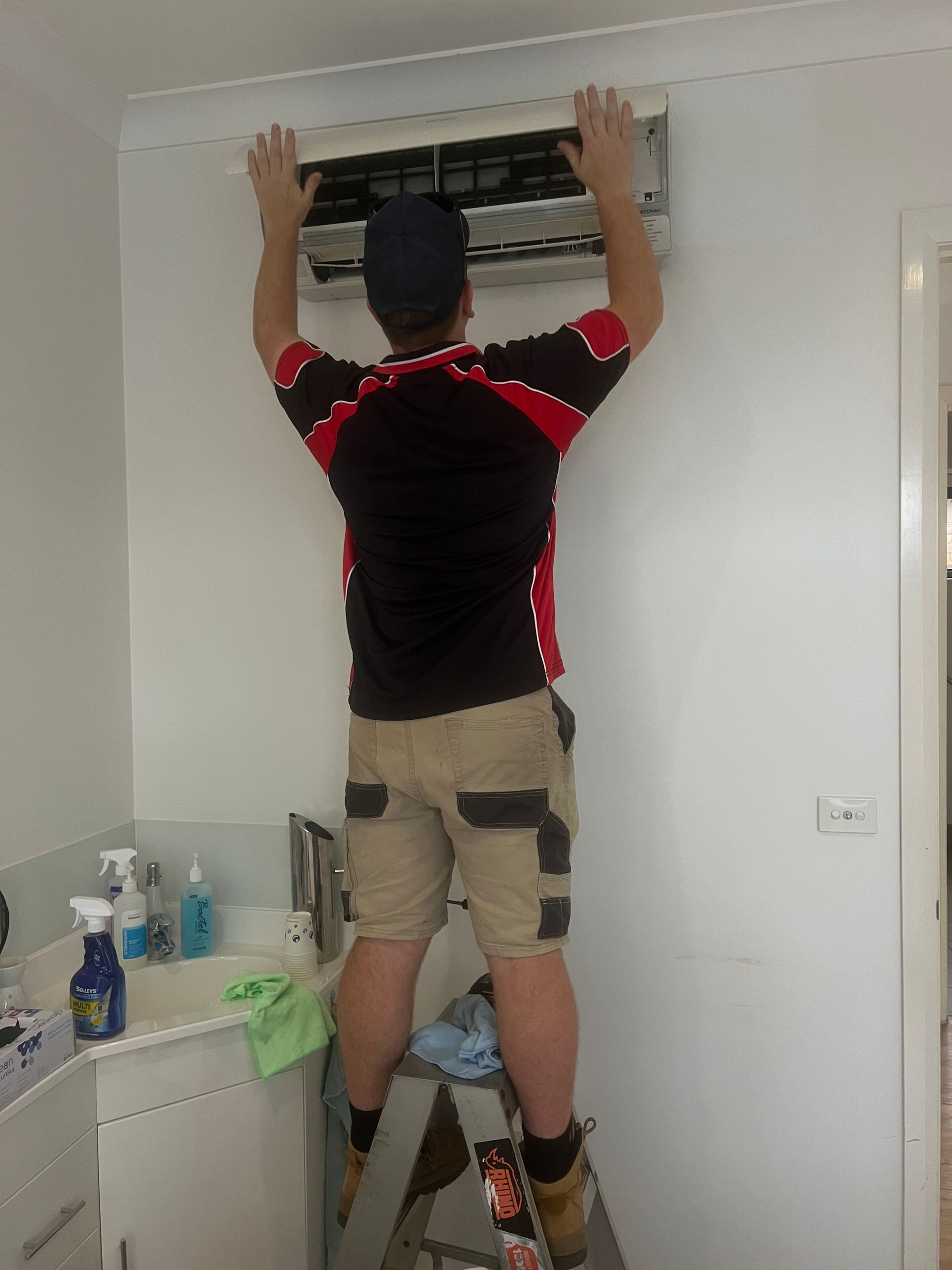 Man Maintaining Air-condition — Coolman Airconditioning in Lismore, NSW