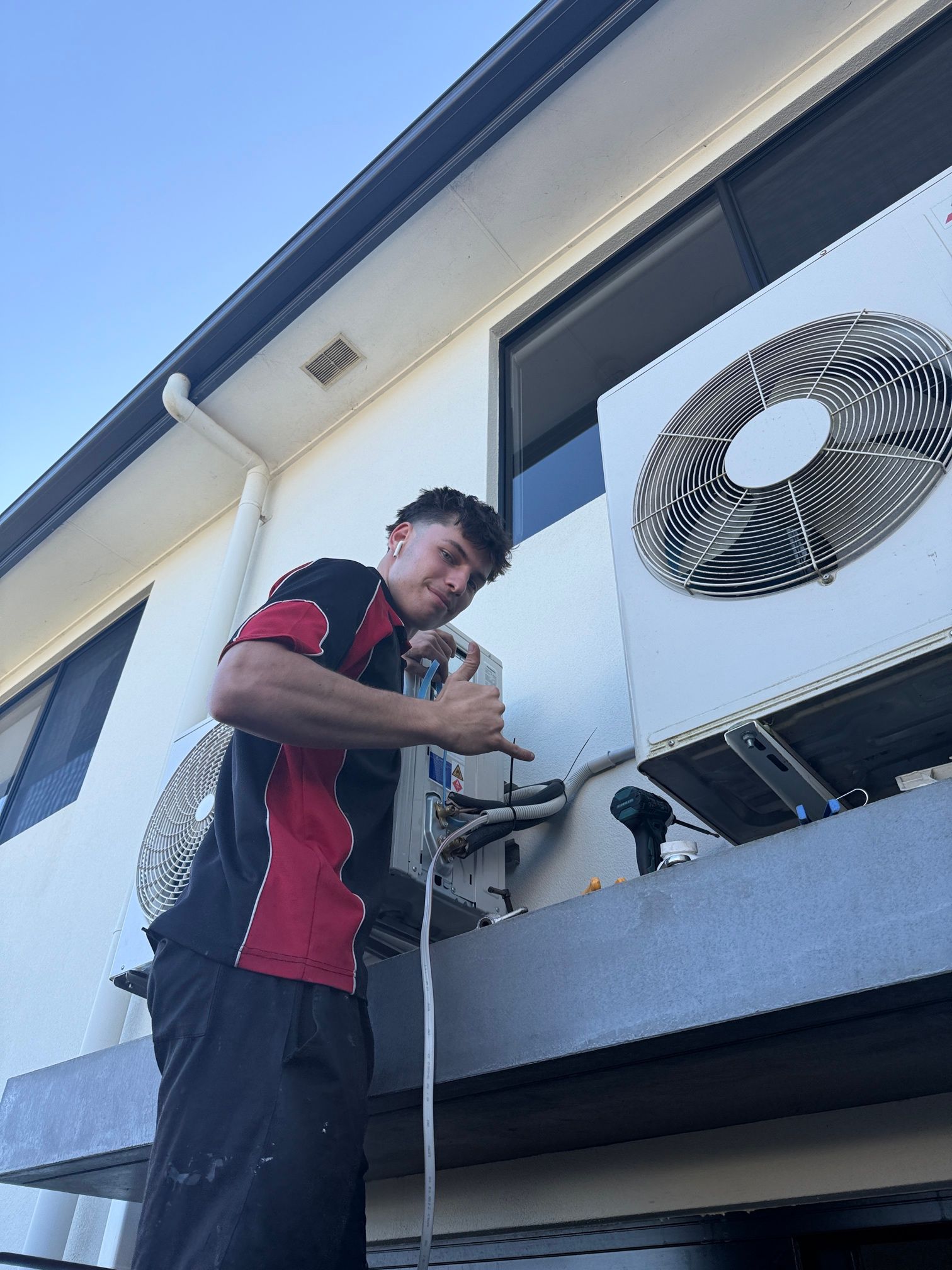 Man Maintaining Air-condition — Coolman Airconditioning in Lennox Head, NSW