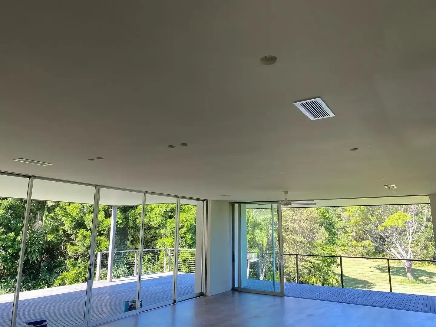 A Large Room With a Lot of Windows and Trees in the Background — Coolman Airconditioning in Ballina, NSW