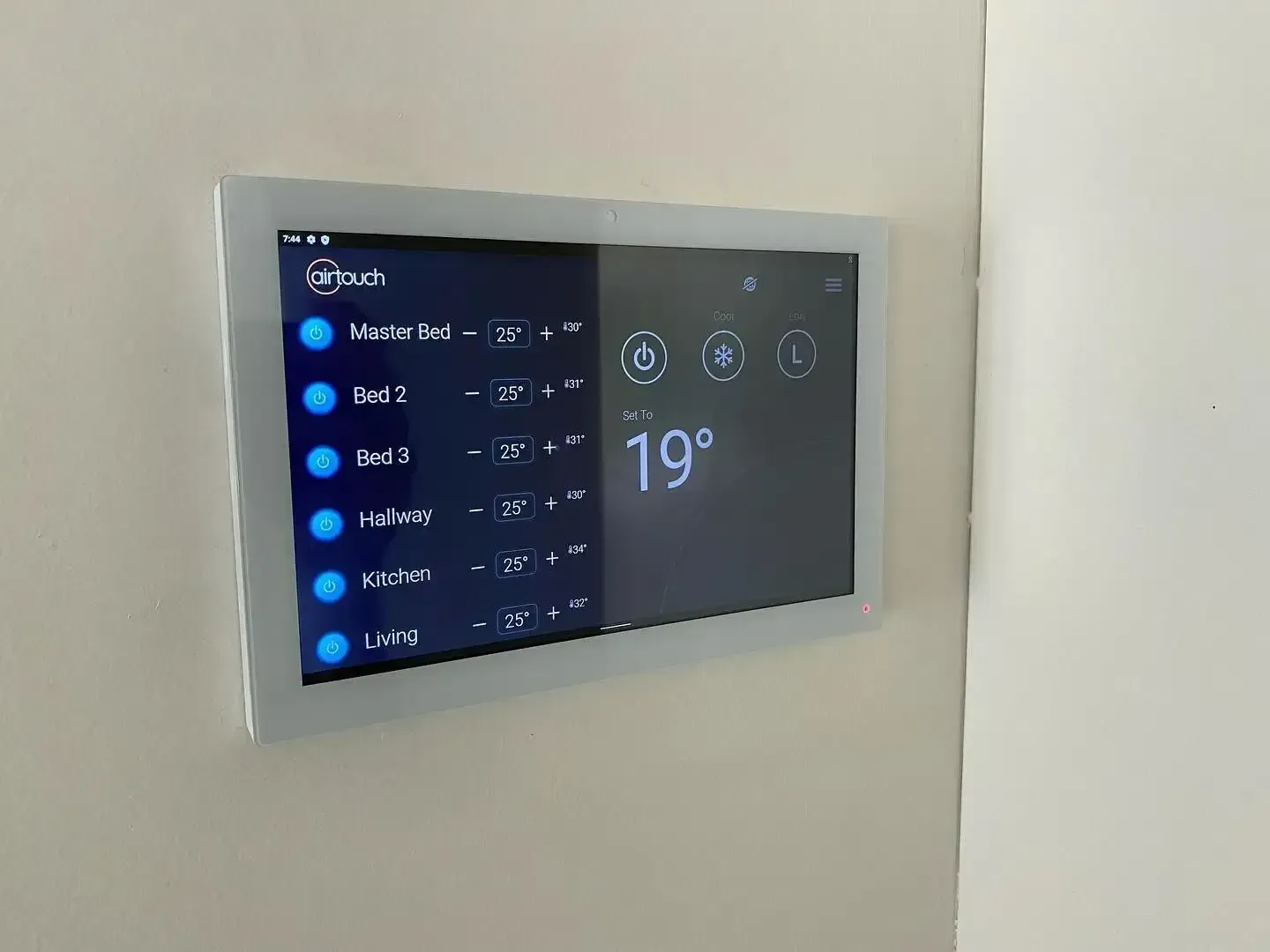 White Air Conditioner controller  is Mounted on the Side of wall -  Coolman Airconditioning in Broken Head, NSW