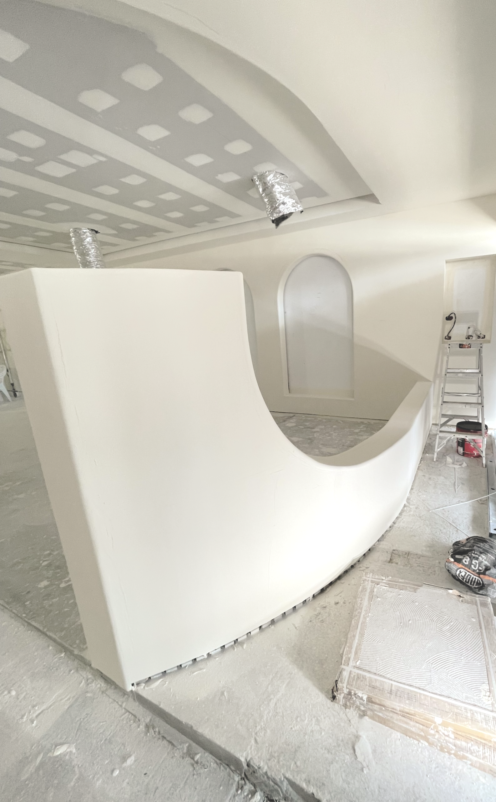 Empty Office Space with Glass-Walled Rooms and Concrete Floor — Completely Plastered North Coast in Goonellabah, NSW