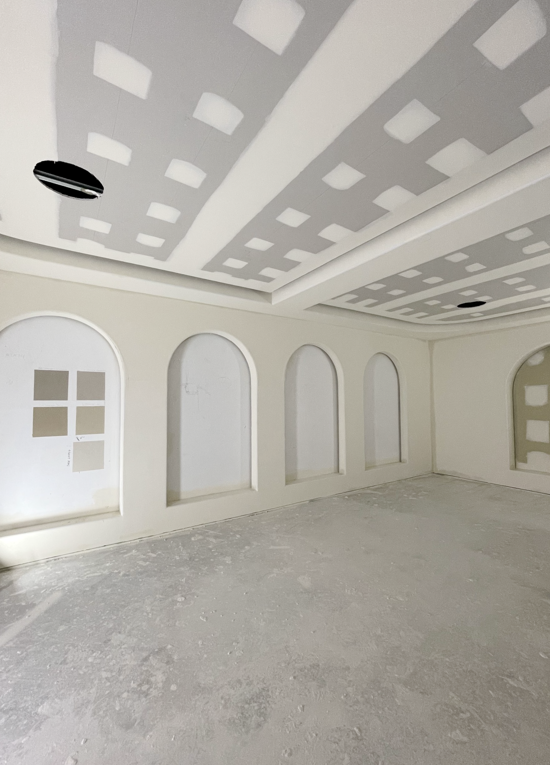 Room with arched wall cutouts and textured ceiling; neutral colours — Completely Plastered North Coast in Goonellabah, NSW