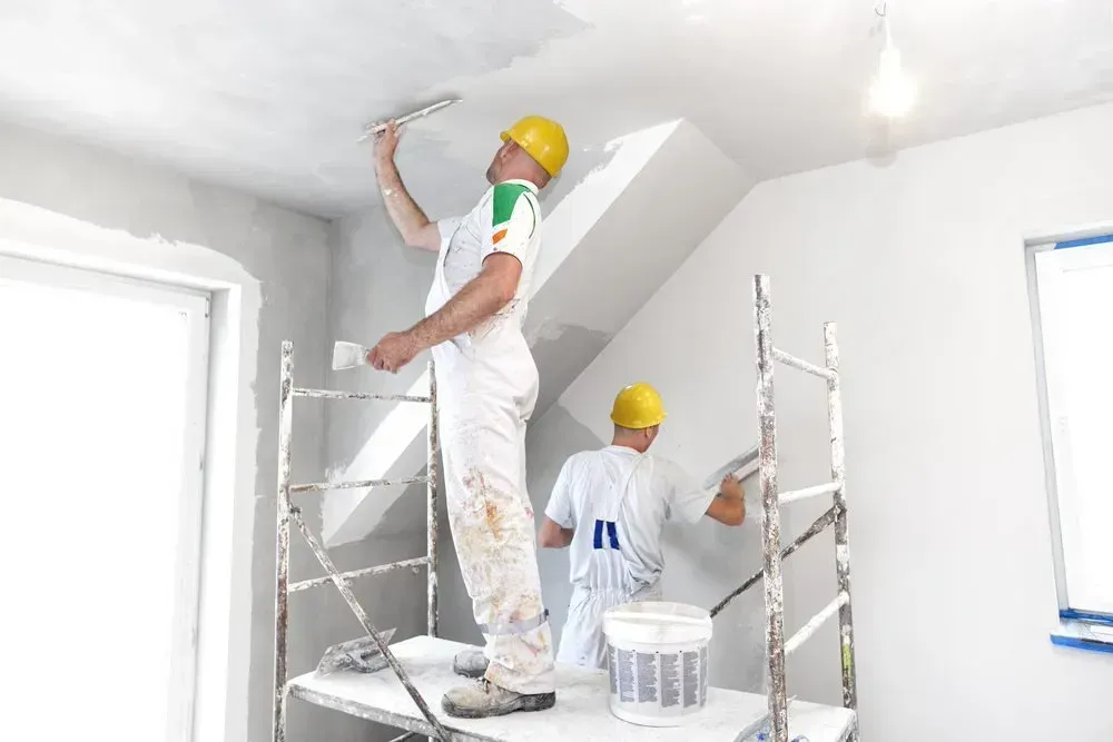 Two Workers Plastering a Ceiling and Wall — Completely Plastered North Coast in Evans Head, NSW