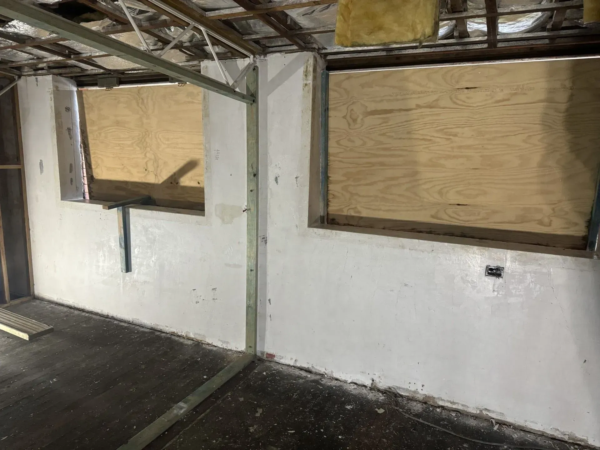 Interior Room with Two Boarded-Up Windows — Completely Plastered North Coast in Lennox Head, NSW