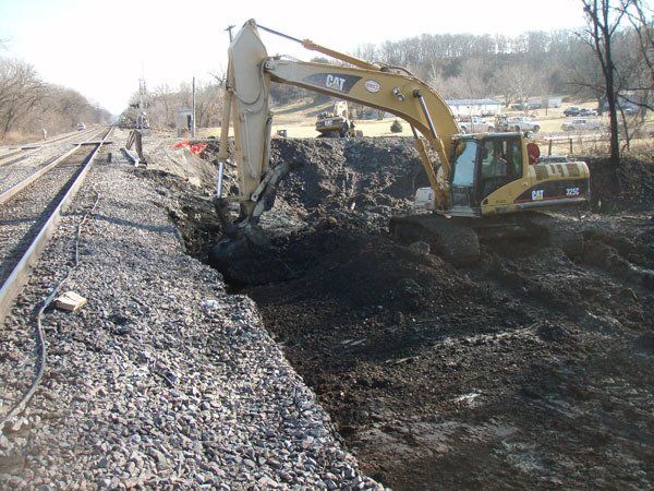 Hulcher excavators perform ditch and culvert work along the right of way an excavation project