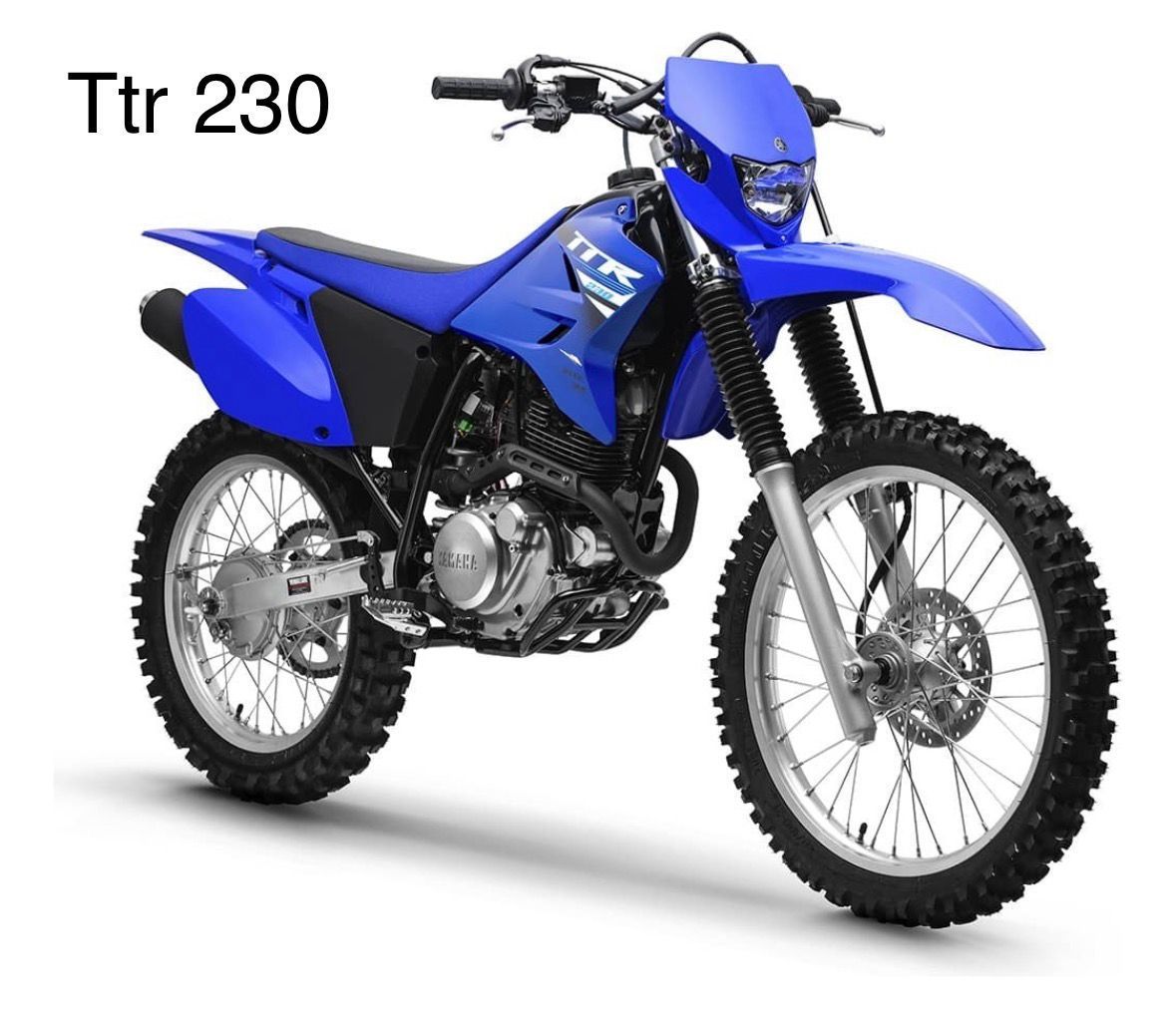 Moto de cross Yamaha TTR 230 de color azul, estilo off-road, sobre fondo blanco.