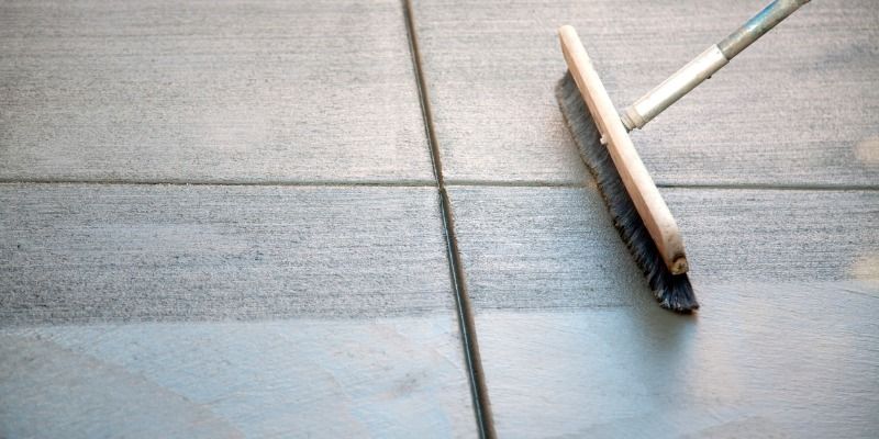 cleaning patio with brush