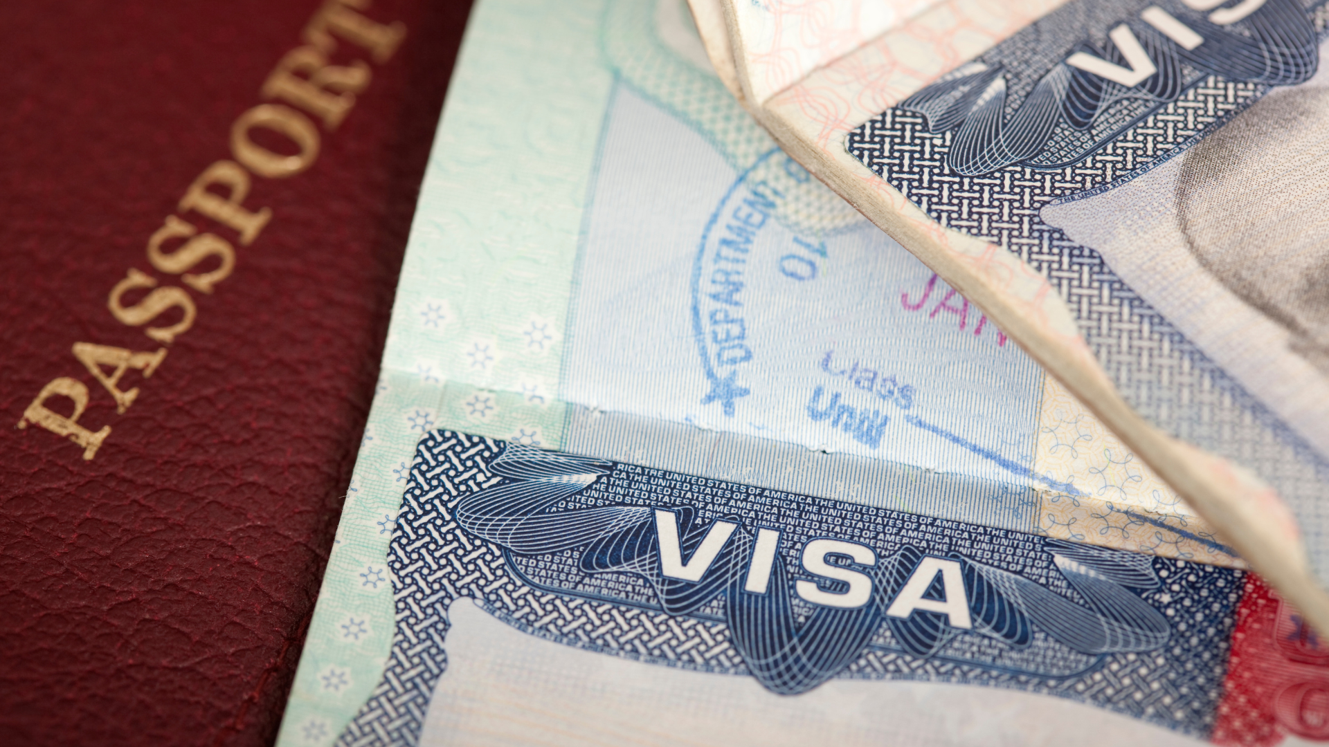 A close up of a passport and a visa
