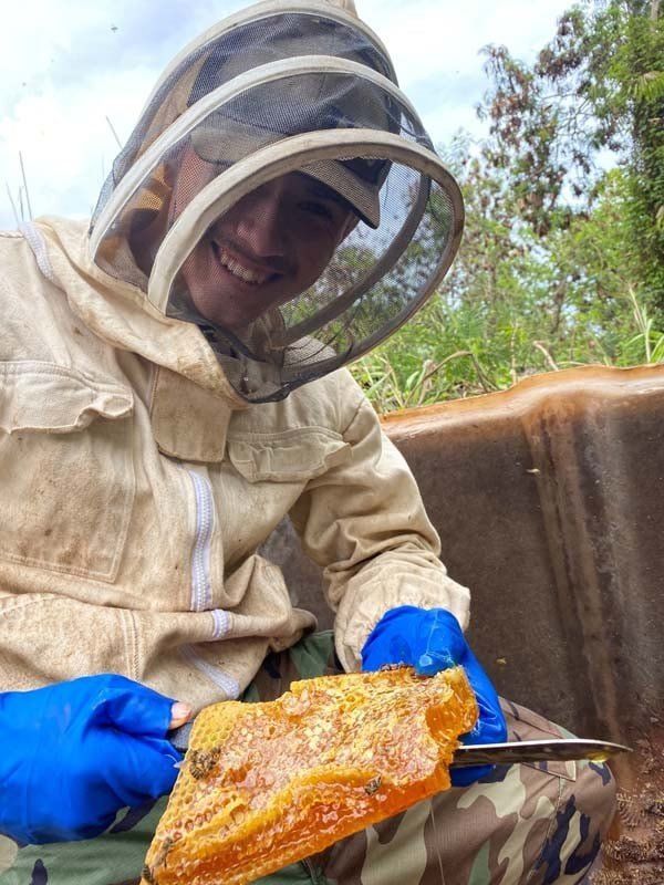 Man Holding Honeycomb — Oahu, HI — Honey Bee Rescue