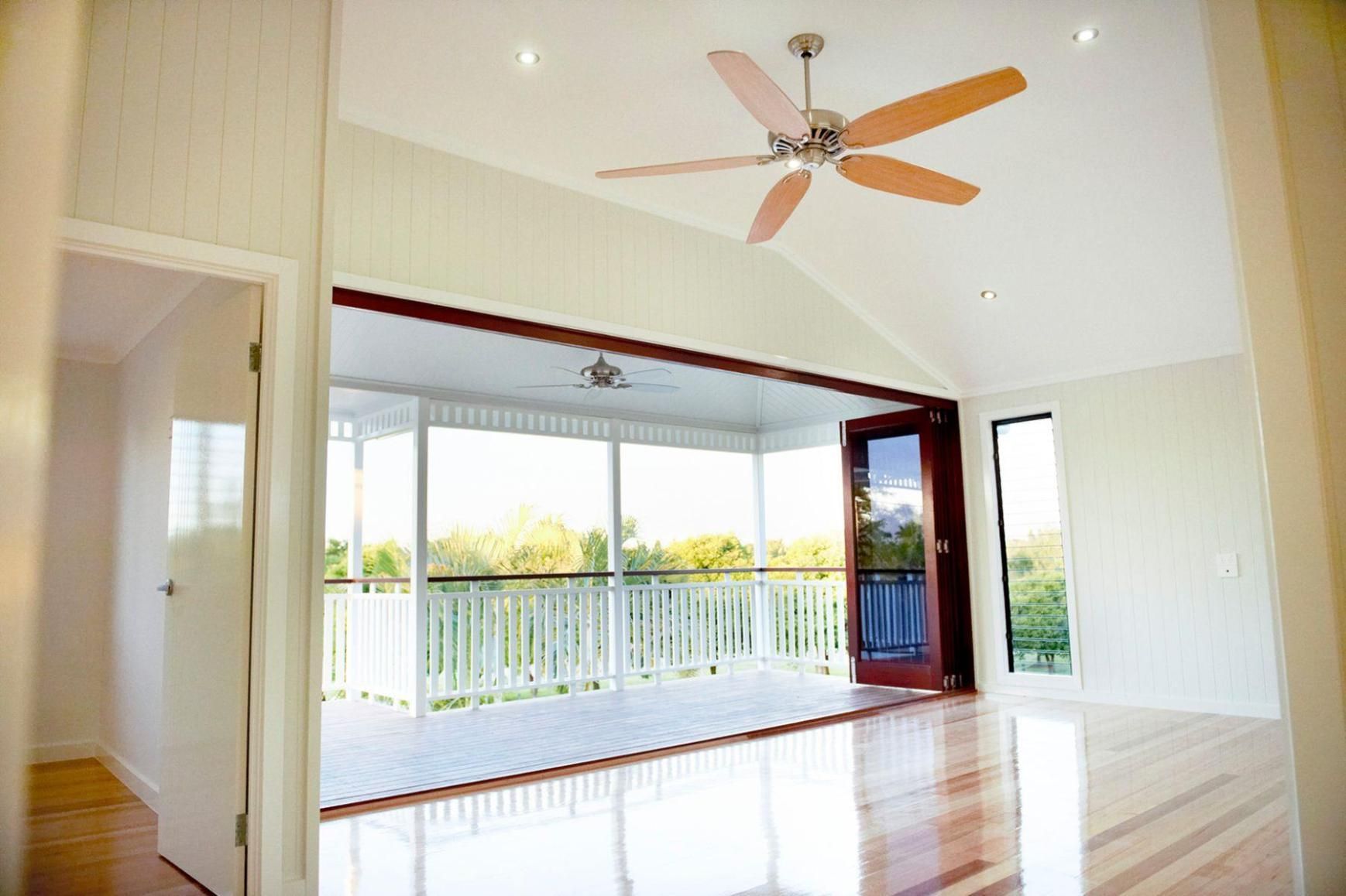 An Empty Room With a Ceiling Fan and a Balcony — Pro-Jax Pty Ltd in Bohle, QLD