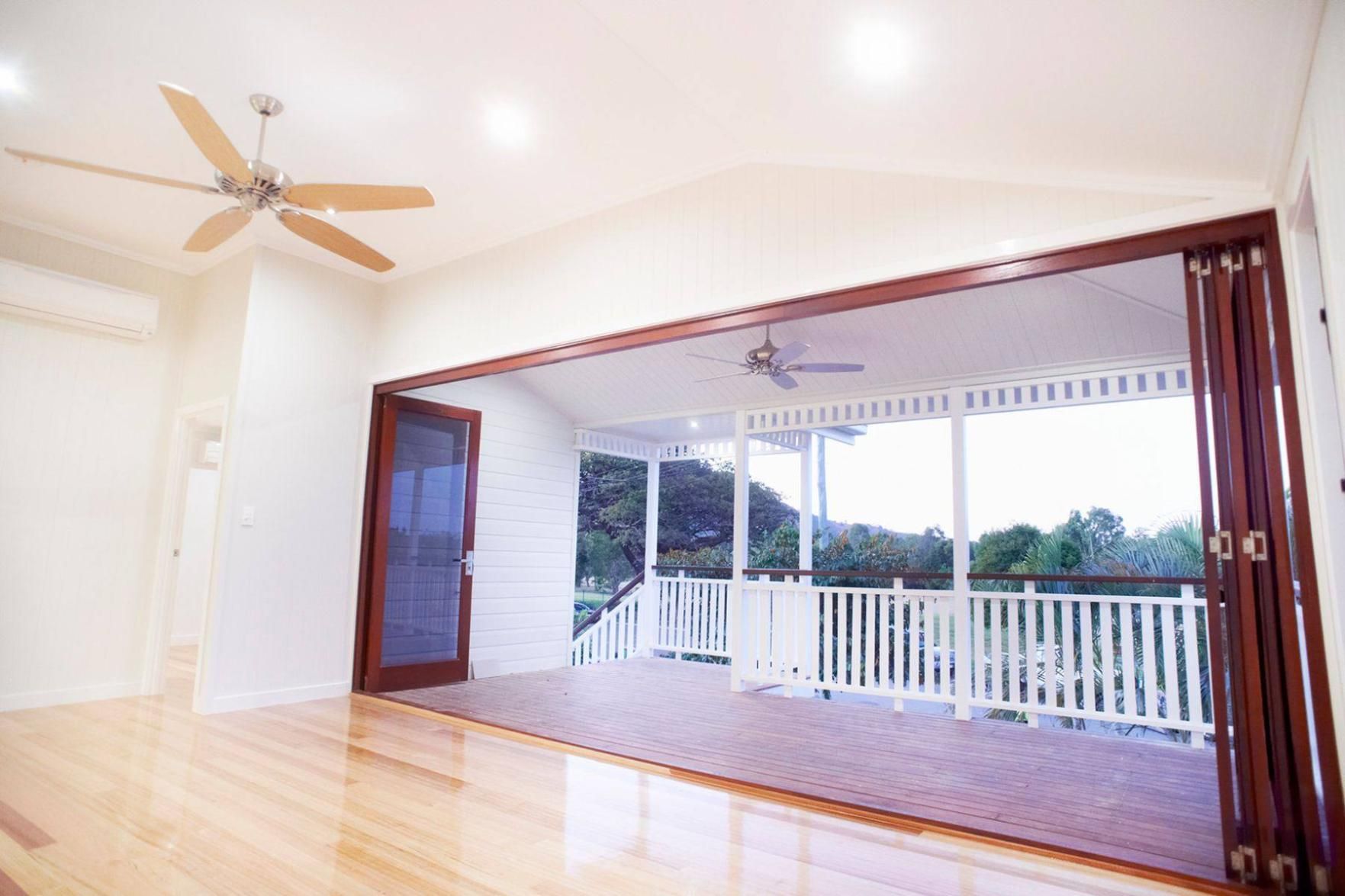 An Empty Room With a Ceiling Fan and a Balcony — Pro-Jax Pty Ltd in Bohle, QLD