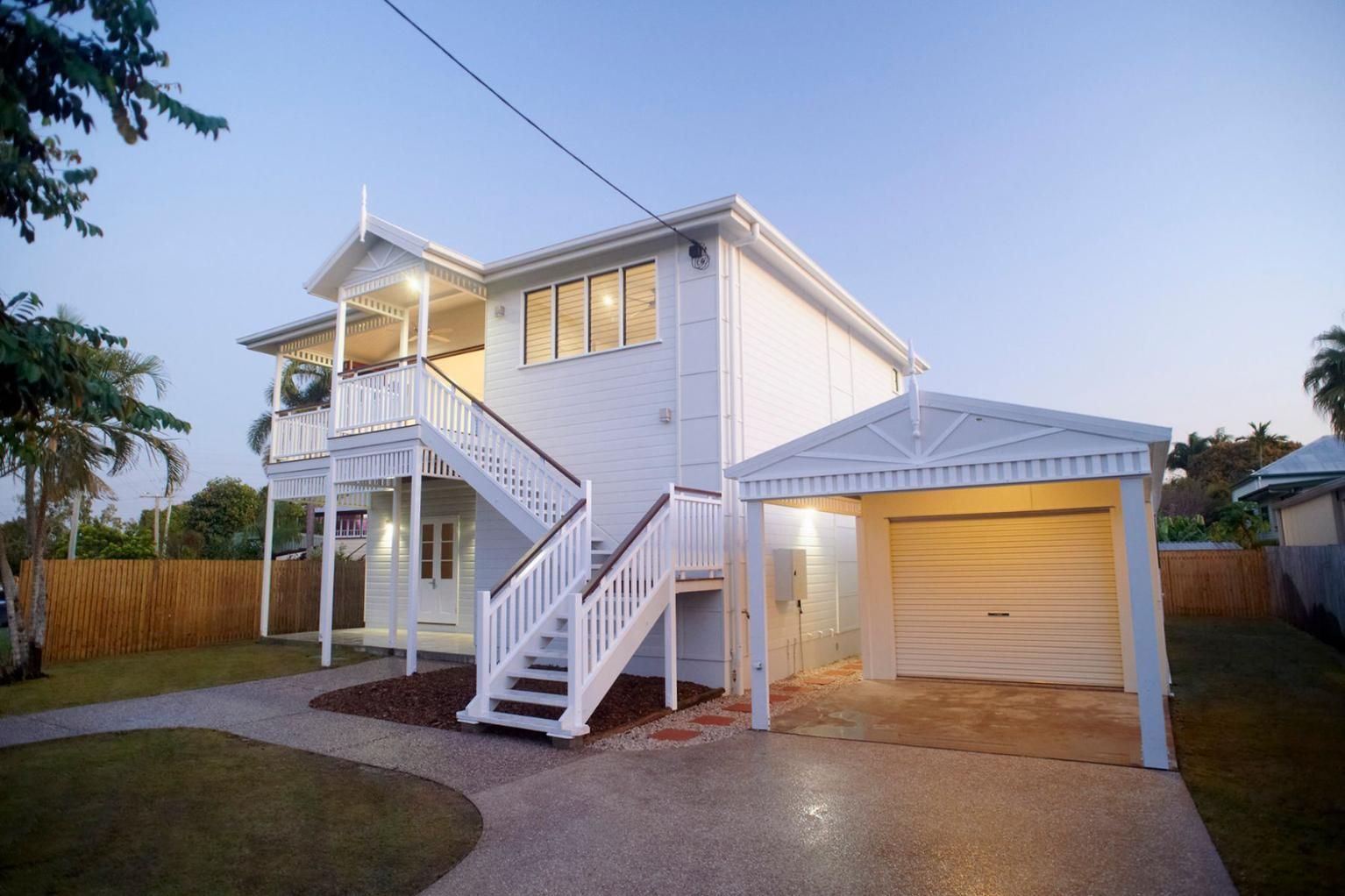A White House With Stairs Leading Up to the Second Floor and a Garage — Pro-Jax Pty Ltd in Bohle, QLD