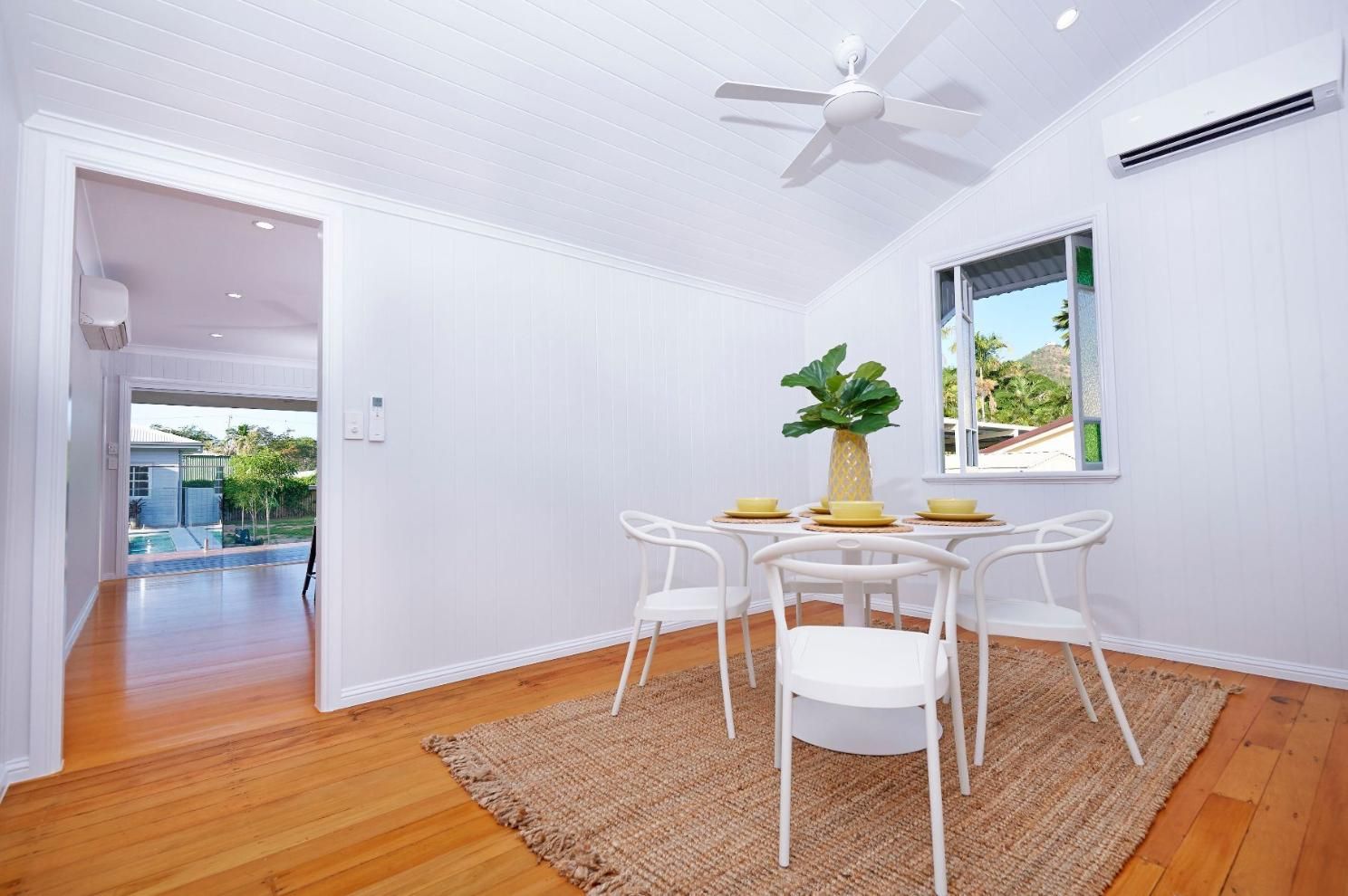 A Dining Room With a Table and Chairs and a Ceiling Fan — Pro-Jax Pty Ltd in Bohle, QLD