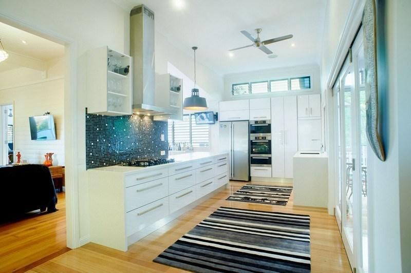 A Kitchen With a Rug on the Floor and a Ceiling Fan — Pro-Jax Pty Ltd in Bohle, QLD