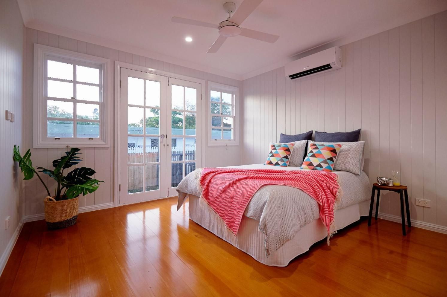 A Bedroom With a Bed and a Ceiling Fan — Pro-Jax Pty Ltd in Bohle, QLD