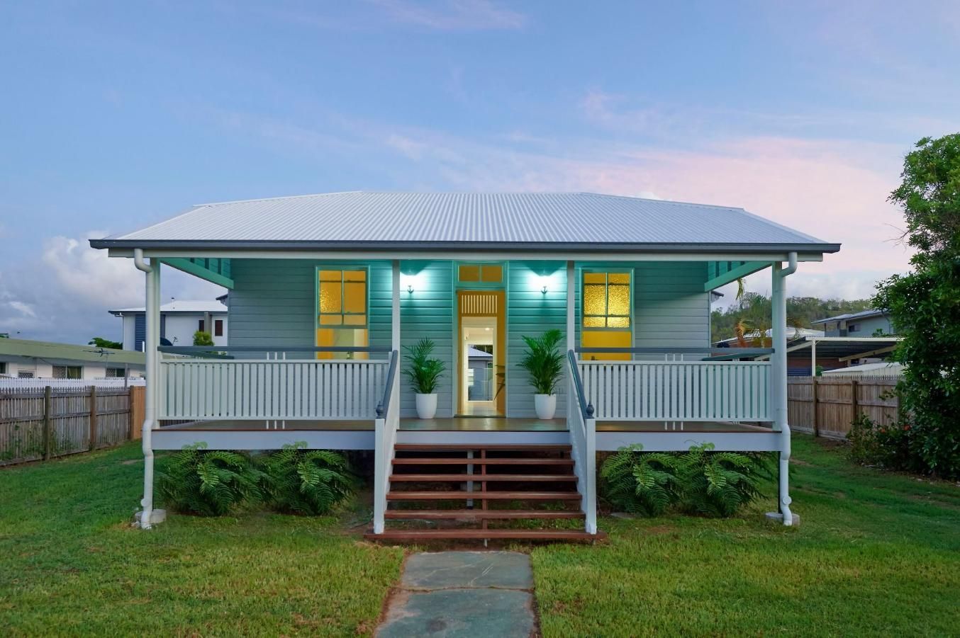 A Small White House With a Porch and Stairs — Pro-Jax Pty Ltd in Bohle, QLD