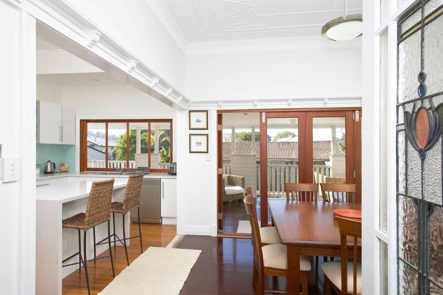 A Kitchen and Dining Room in A House with A Table and Chairs — Pro-Jax Pty Ltd in Bohle, QLD