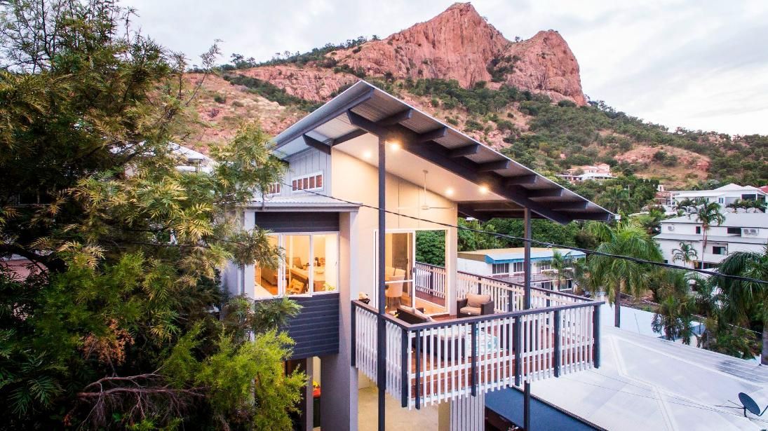 A House With a Balcony and a Mountain in the Background — Pro-Jax Pty Ltd in Bohle, QLD