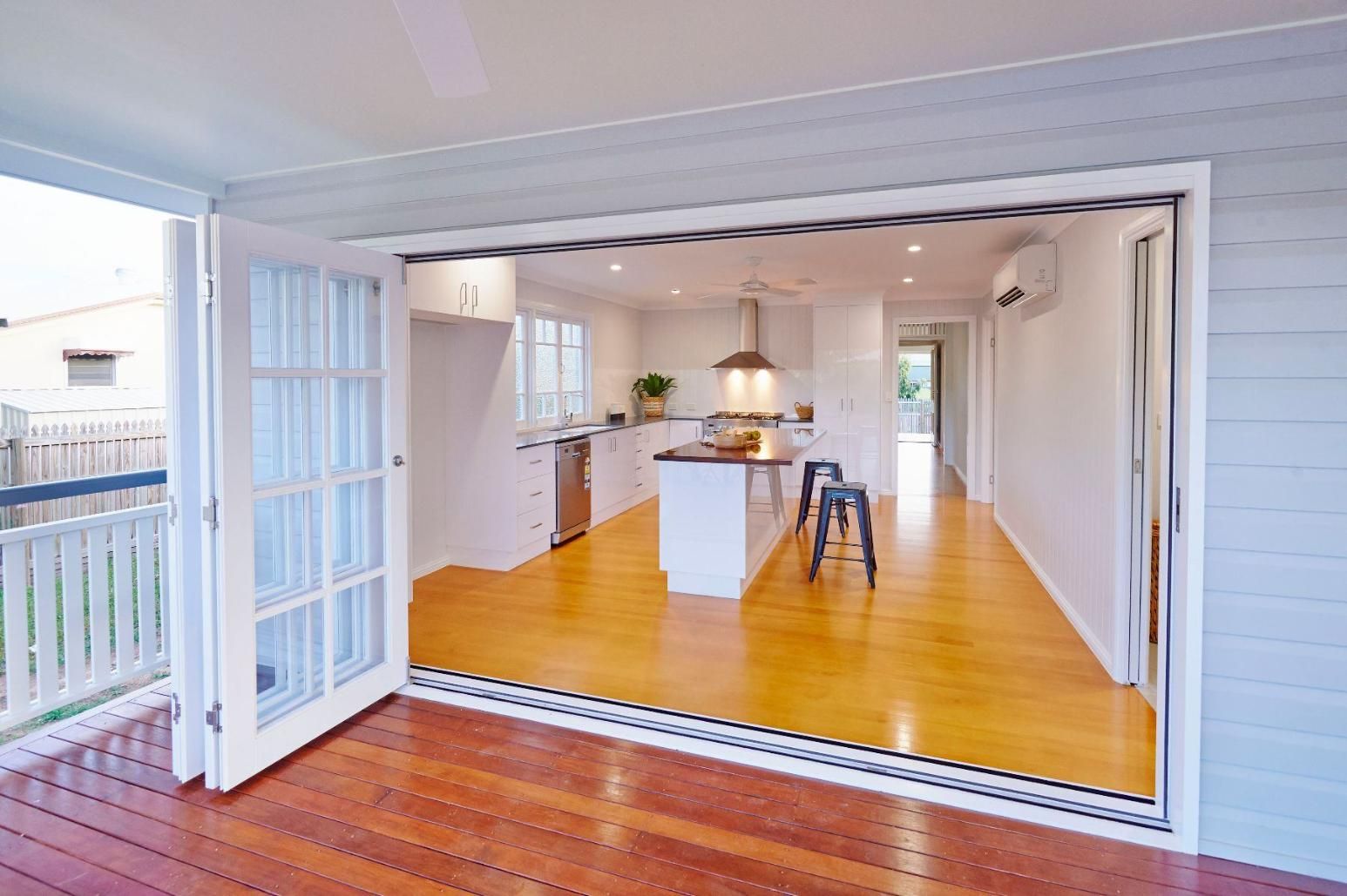 A View of a Kitchen From a Deck With Sliding Glass Doors — Pro-Jax Pty Ltd in Bohle, QLD