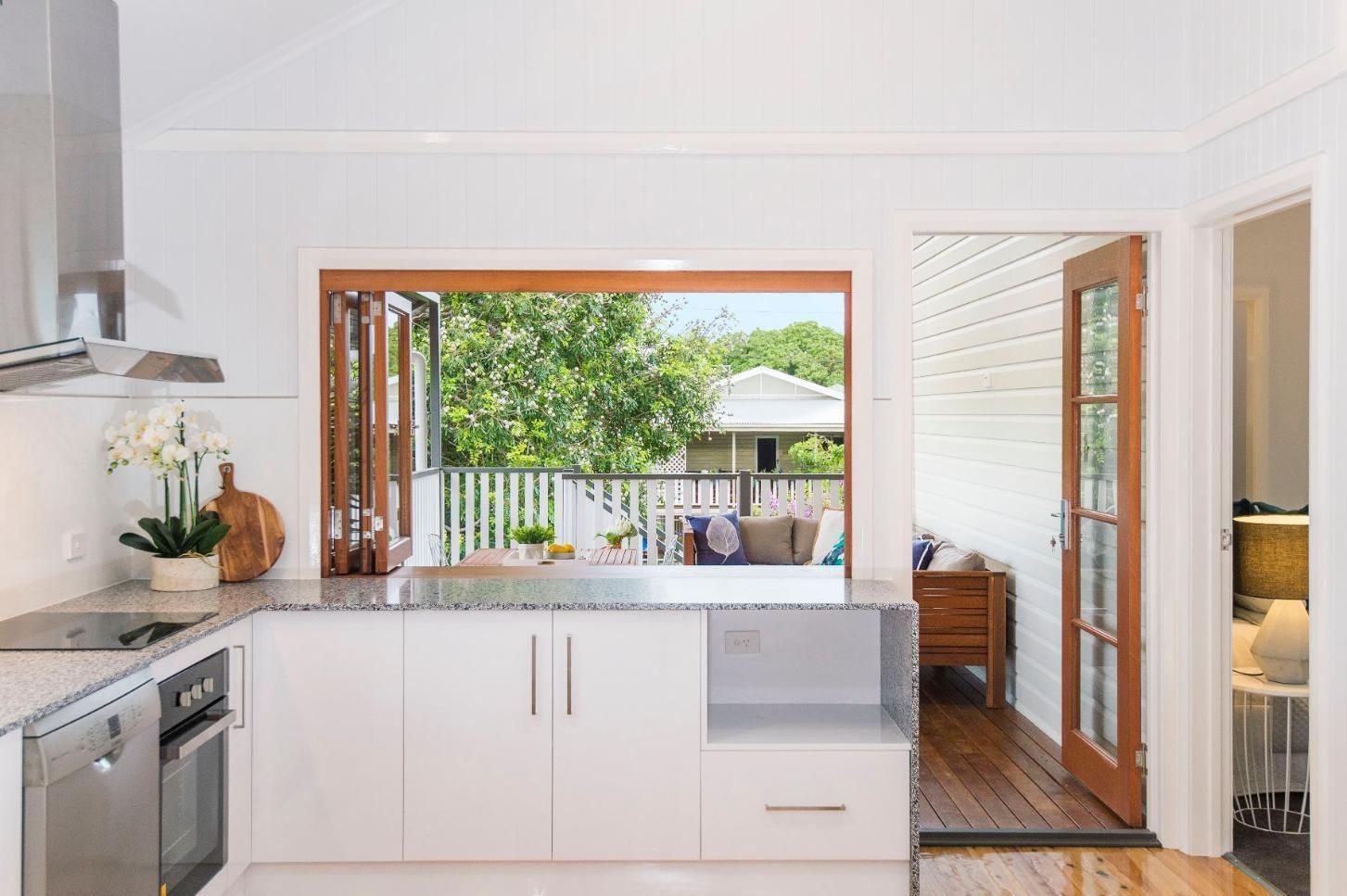 A Kitchen With a Large Window and a View of a Deck — Pro-Jax Pty Ltd in Bohle, QLD