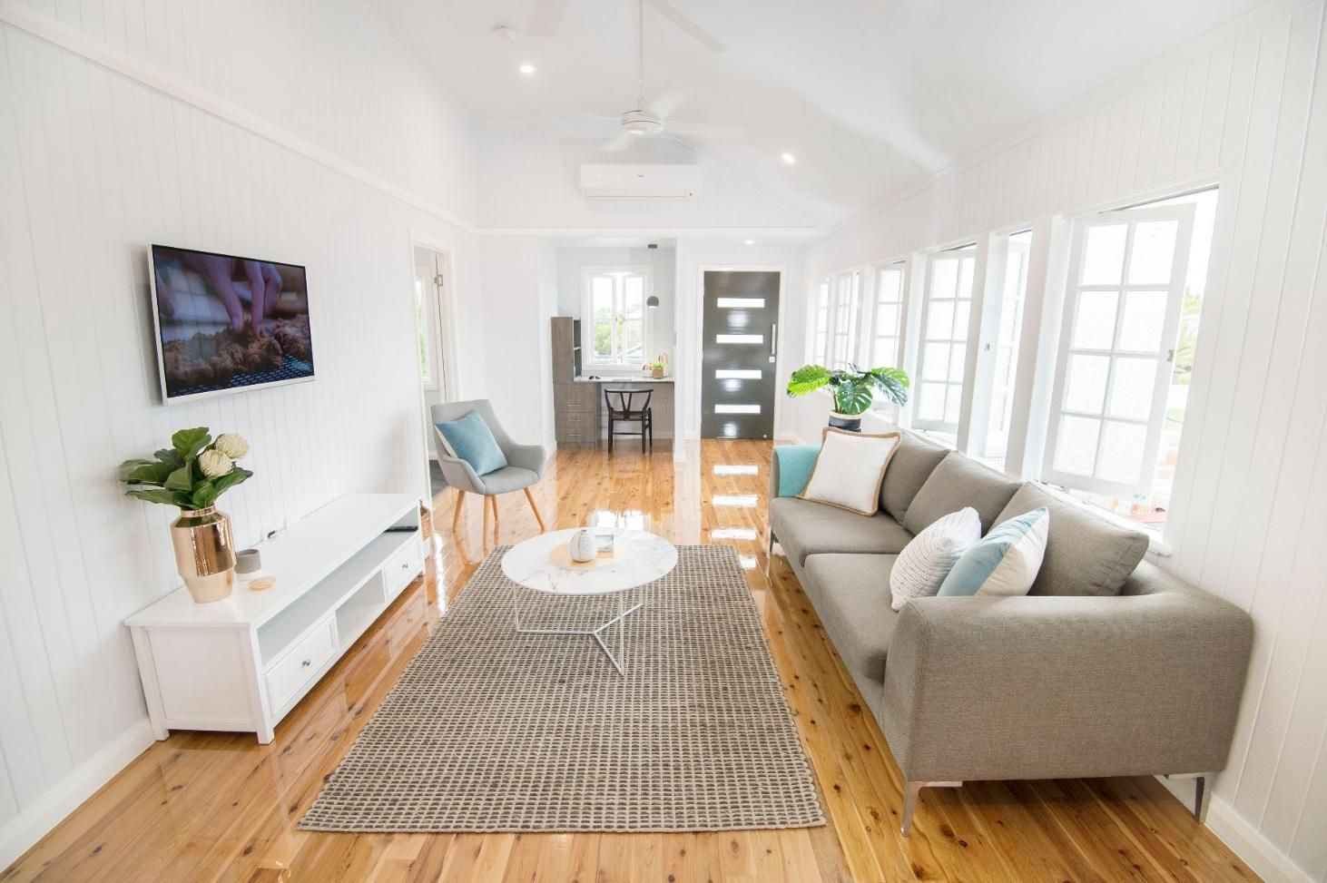 A Living Room With a Couch, Table, and Television — Pro-Jax Pty Ltd in Bohle, QLD