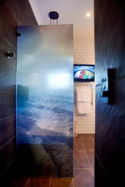 A Bathroom With a Picture of the Ocean on the Wall — Pro-Jax Pty Ltd in Bohle, QLD