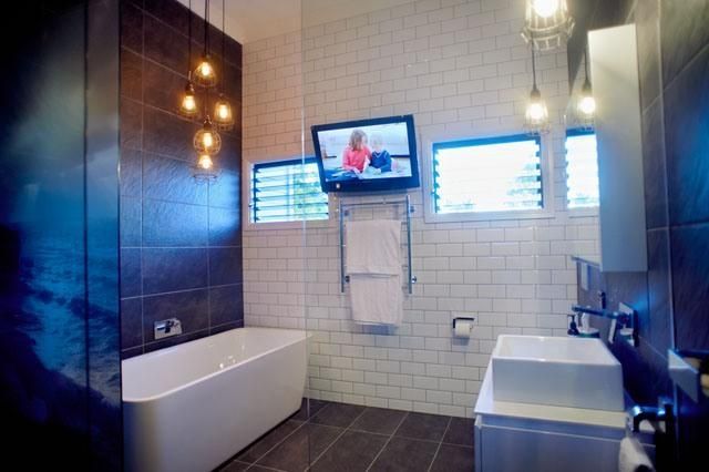 A Bathroom With a Sink and a Television on the Wall — Pro-Jax Pty Ltd in Bohle, QLD