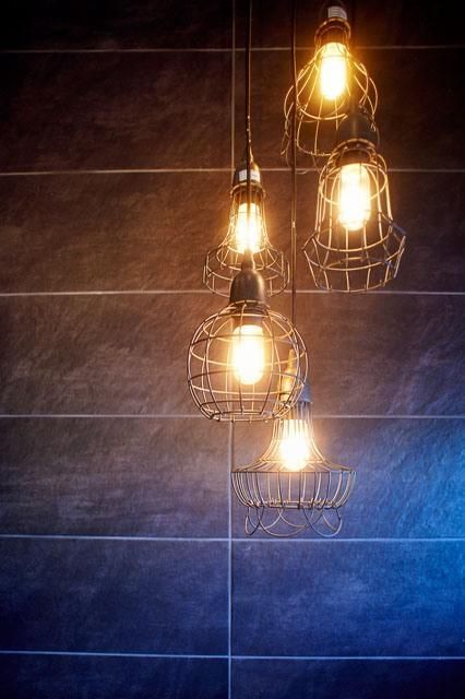 A Bunch of Light Bulbs Hanging From the Ceiling — Pro-Jax Pty Ltd in Bohle, QLD