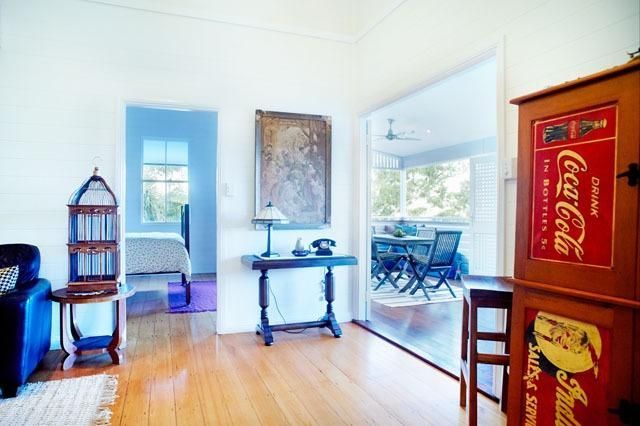 A Living Room With a Coca Cola Sign on the Wall — Pro-Jax Pty Ltd in Bohle, QLD