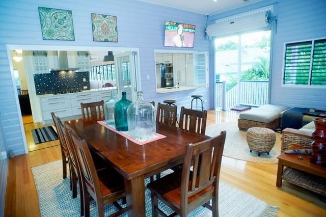 A Dining Room With a Wooden Table and Chairs — Pro-Jax Pty Ltd in Bohle, QLD