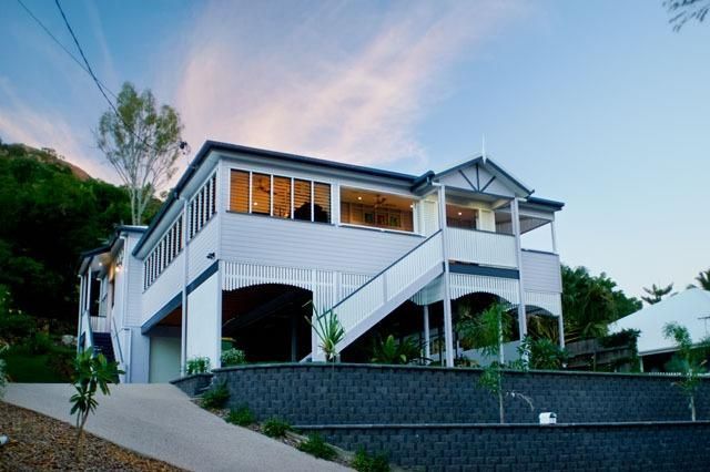 A Large White House With Stairs Leading Up to It — Pro-Jax Pty Ltd in Bohle, QLD
