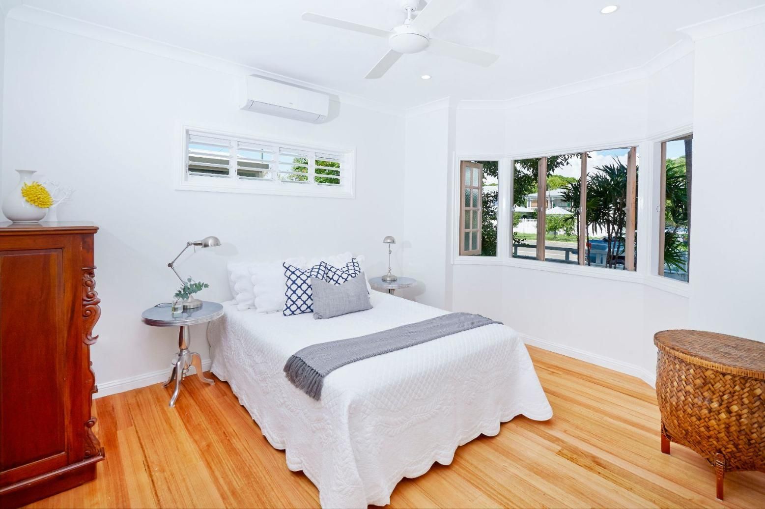 A Bedroom With a Large Bed, a Dresser, and a Ceiling Fan — Pro-Jax Pty Ltd in Bohle, QLD