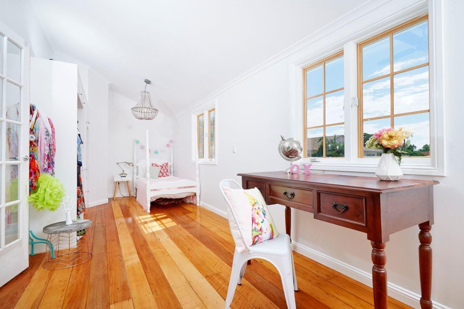 A Bedroom With a Wooden Floor, a Desk, a Chair and a Bed — Pro-Jax Pty Ltd in Bohle, QLD